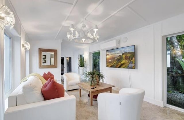 living room featuring a chandelier and a wealth of natural light