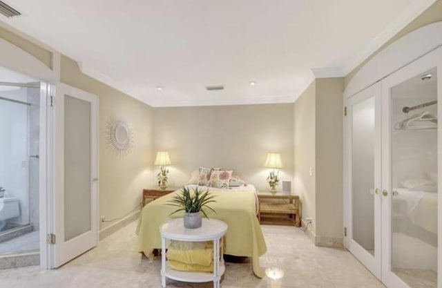 bedroom with crown molding and french doors