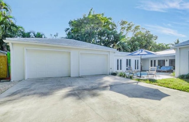 single story home with a garage