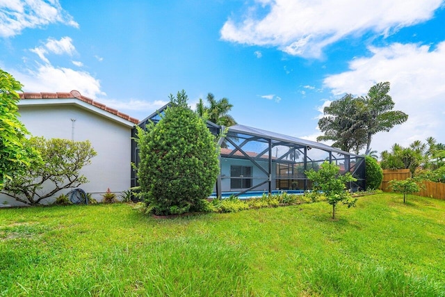 view of yard with a lanai