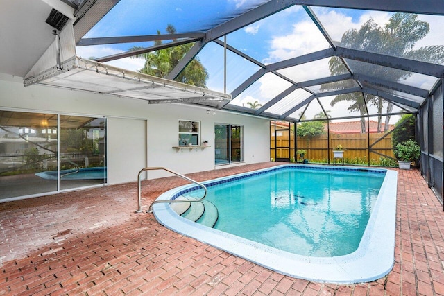 view of pool featuring a lanai and a patio area