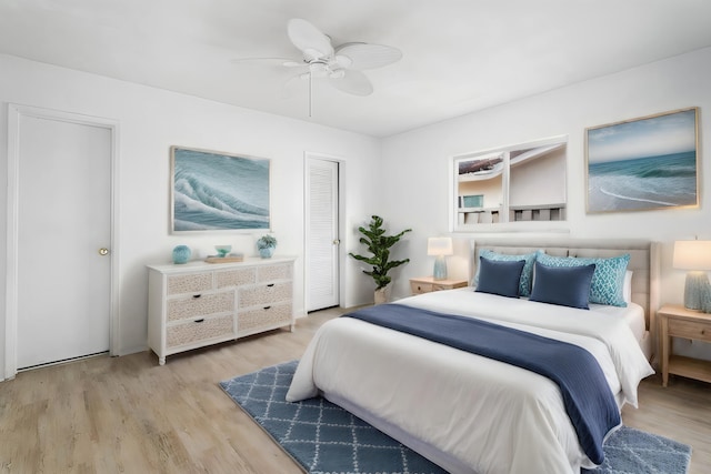 bedroom featuring ceiling fan and light hardwood / wood-style floors