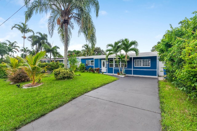 ranch-style house with a front lawn