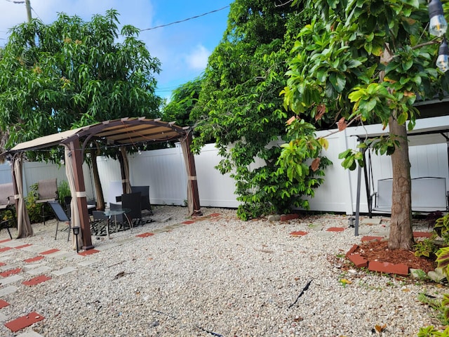 view of yard with a patio area and a pergola