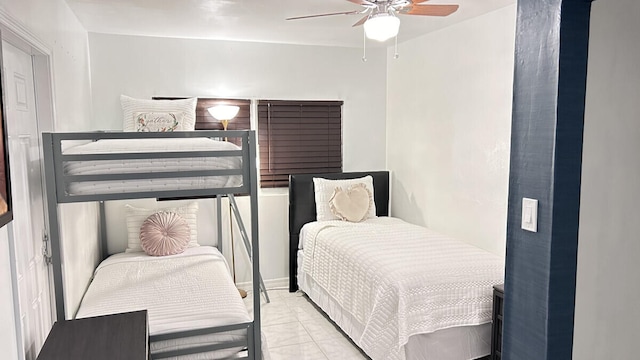 bedroom featuring ceiling fan and light tile patterned floors