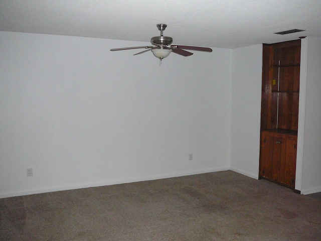 carpeted empty room with ceiling fan