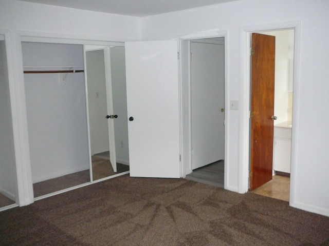 unfurnished bedroom featuring dark colored carpet