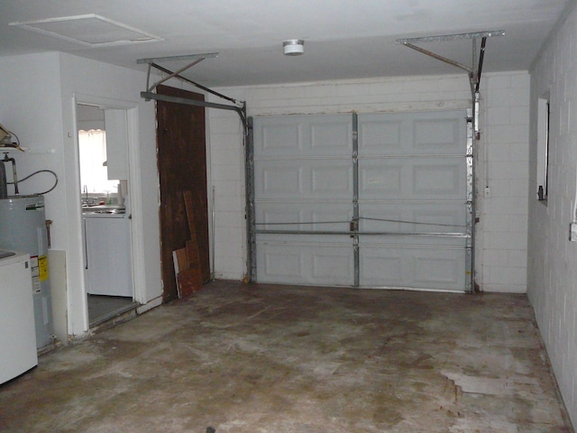 garage featuring washer / dryer and water heater