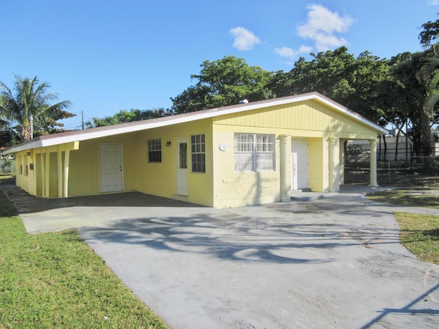 view of front of home with a carport