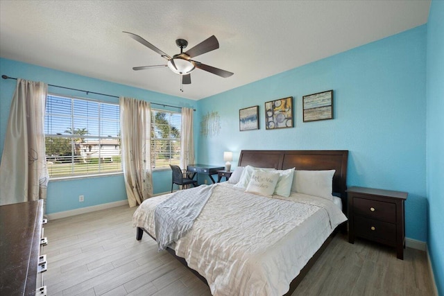 bedroom featuring ceiling fan and hardwood / wood-style flooring