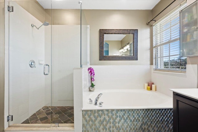 bathroom with vanity and separate shower and tub