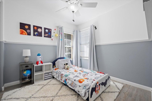 bedroom featuring ceiling fan and hardwood / wood-style flooring