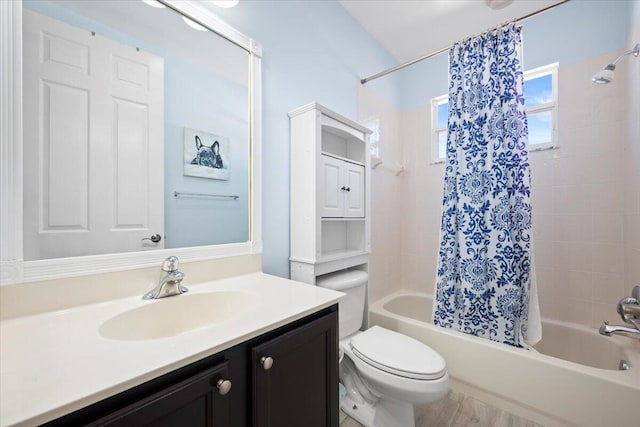 full bathroom with vanity, toilet, and shower / tub combo