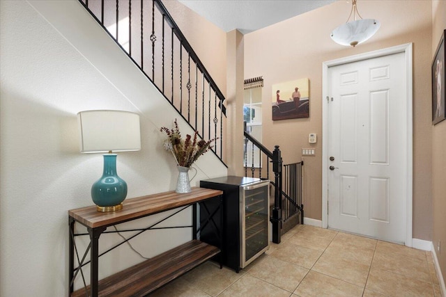 tiled foyer with wine cooler