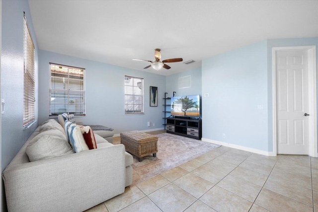 tiled living room featuring ceiling fan