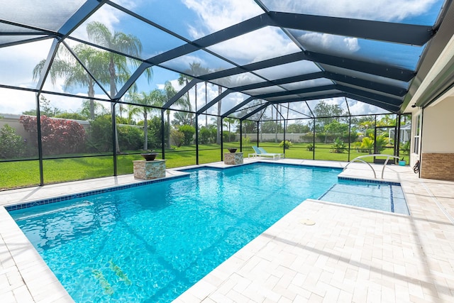 view of pool with a yard, a patio, and glass enclosure