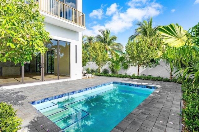 view of pool featuring a patio and a pool