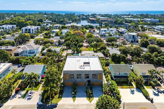 birds eye view of property with a water view and a residential view
