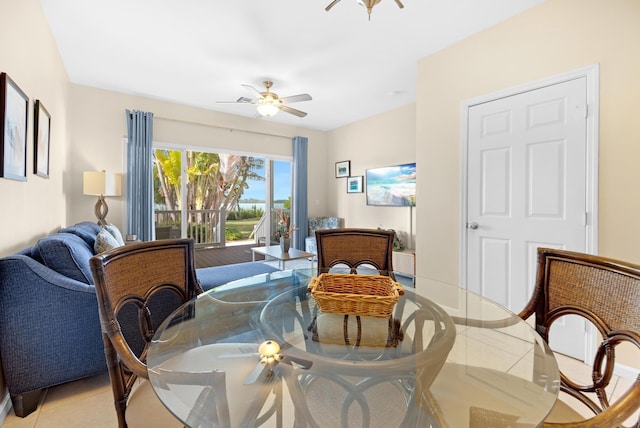 dining space featuring ceiling fan and light tile patterned flooring