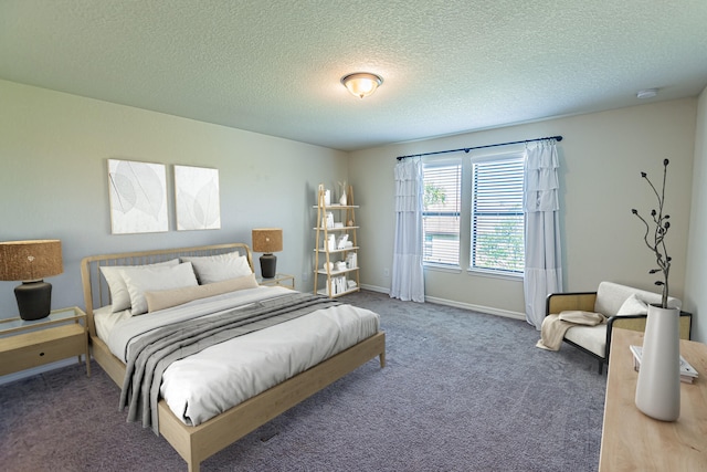 carpeted bedroom with a textured ceiling