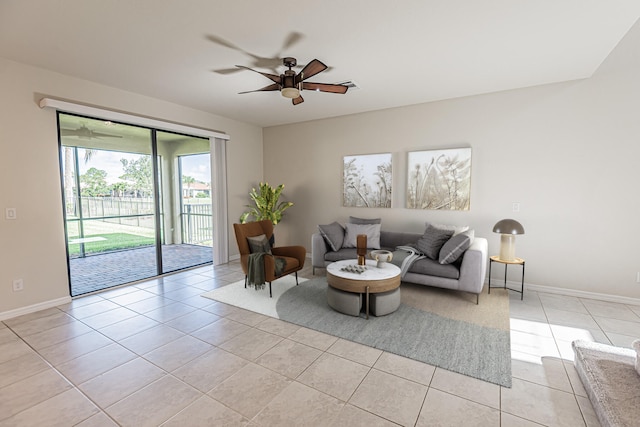 tiled living room featuring ceiling fan