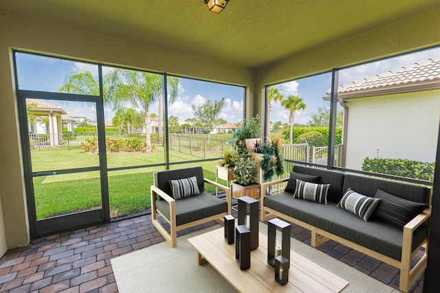 sunroom / solarium featuring plenty of natural light