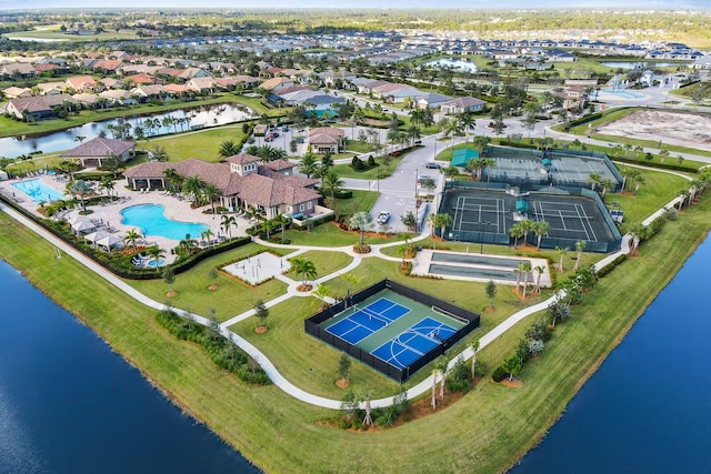 birds eye view of property with a water view