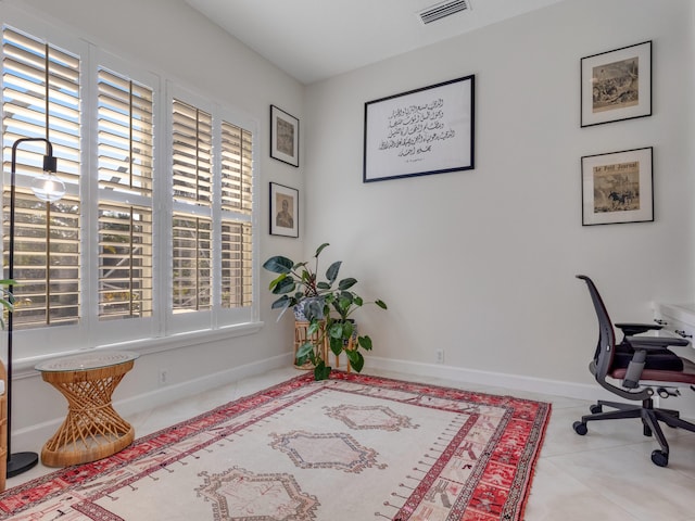 office area with light tile patterned floors