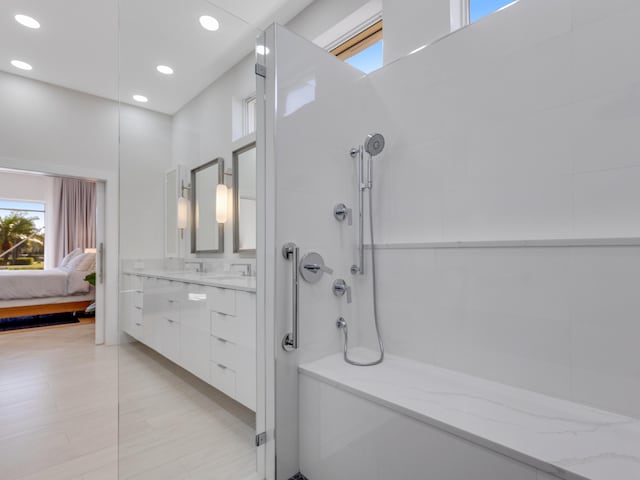 bathroom with vanity and walk in shower