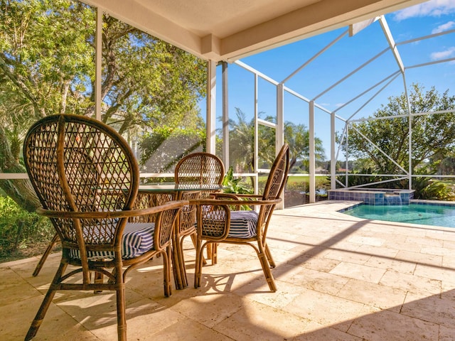 view of patio / terrace featuring a lanai