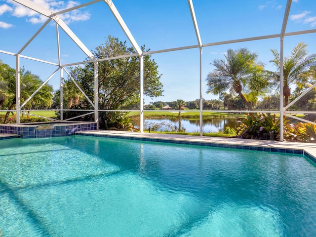 view of pool featuring glass enclosure and a water view