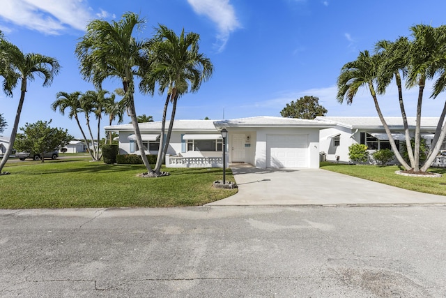 single story home with a front yard and a garage