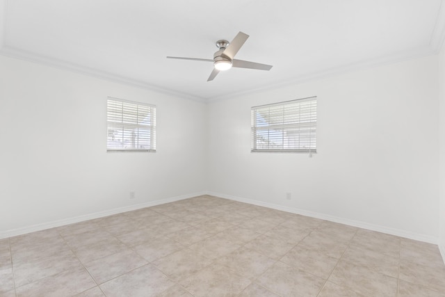 tiled spare room featuring ceiling fan, a healthy amount of sunlight, and crown molding