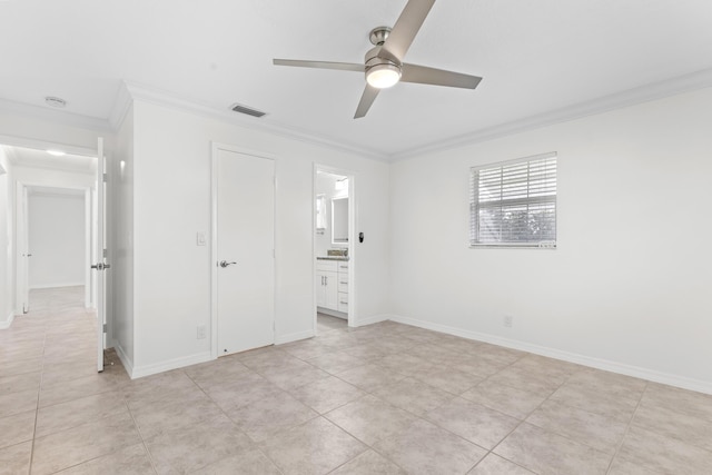 unfurnished bedroom with light tile patterned floors, connected bathroom, ceiling fan, and ornamental molding