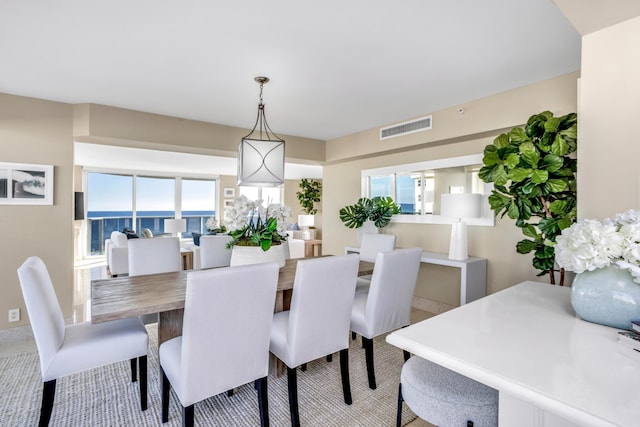 dining space with a water view