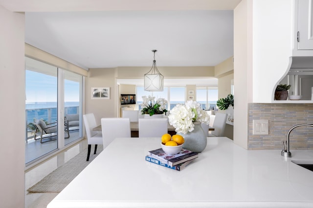 dining space featuring plenty of natural light and sink