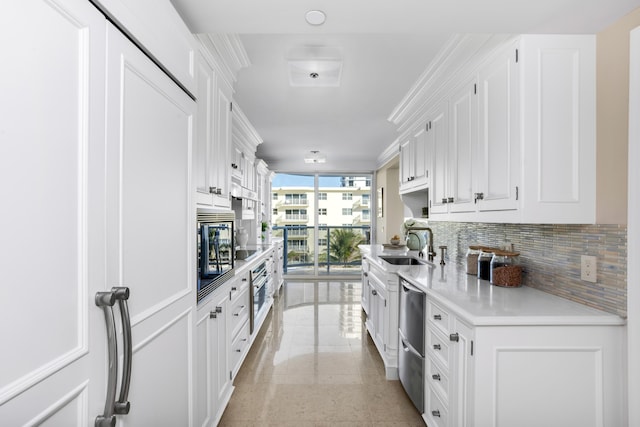 kitchen featuring backsplash, floor to ceiling windows, stainless steel oven, built in microwave, and white cabinetry