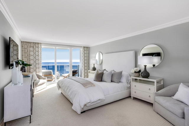 carpeted bedroom with floor to ceiling windows, a water view, and ornamental molding