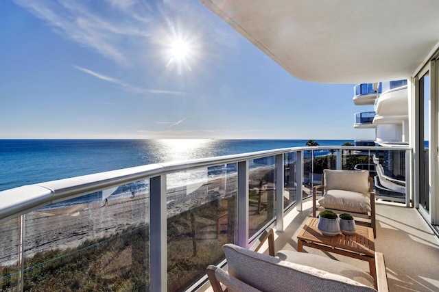 balcony featuring a water view