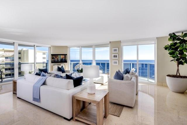 living room with a water view and expansive windows