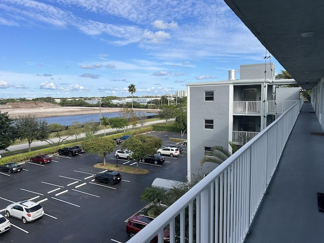 balcony featuring a water view