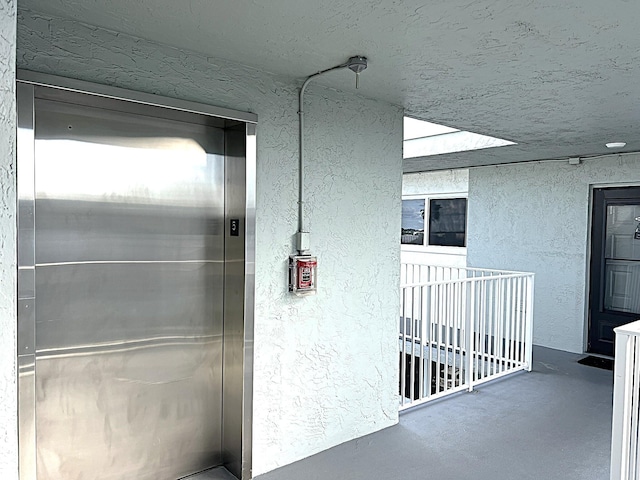 entrance to property featuring elevator