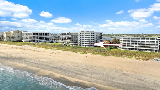 aerial view featuring a water view and a view of the beach