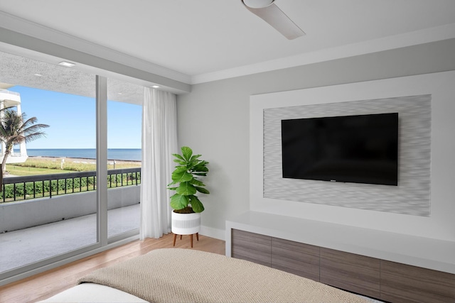 bedroom with access to exterior, ceiling fan, light hardwood / wood-style flooring, and crown molding