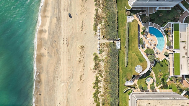 birds eye view of property featuring a water view and a view of the beach