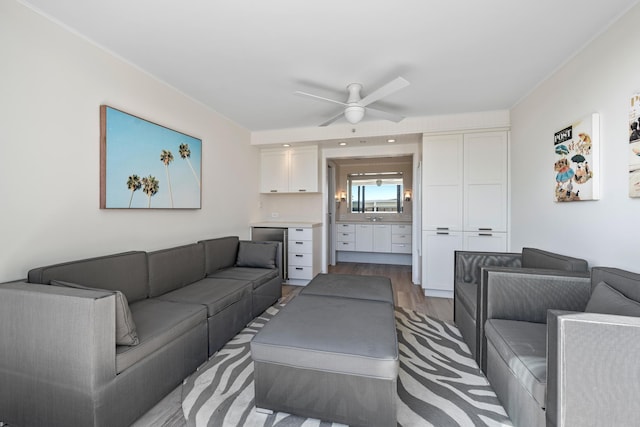 living room with hardwood / wood-style flooring and ceiling fan