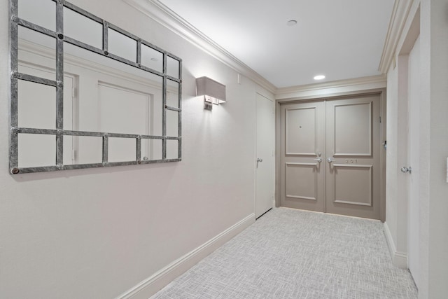 hall with light carpet and crown molding