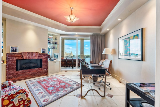 tiled office space featuring ornamental molding and a raised ceiling