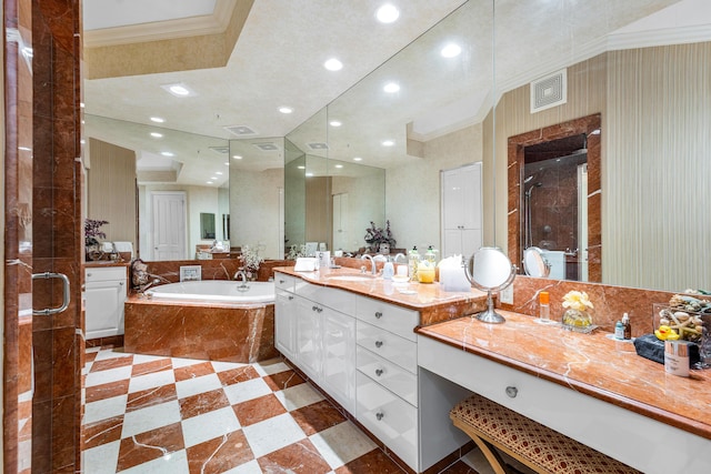 bathroom featuring plus walk in shower, vanity, and crown molding