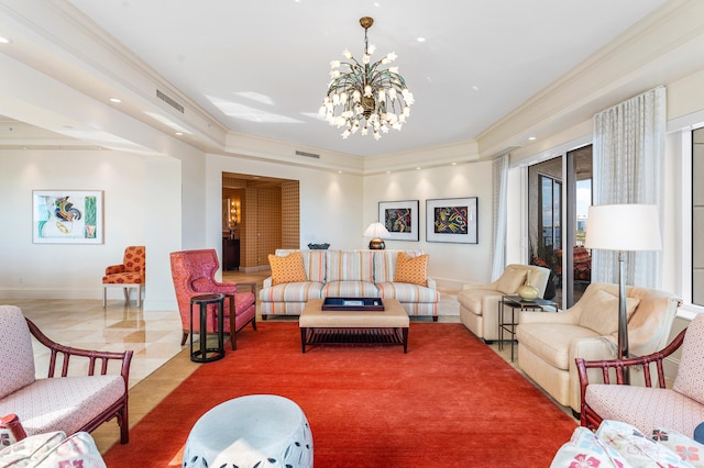 living room featuring an inviting chandelier, a tray ceiling, and ornamental molding